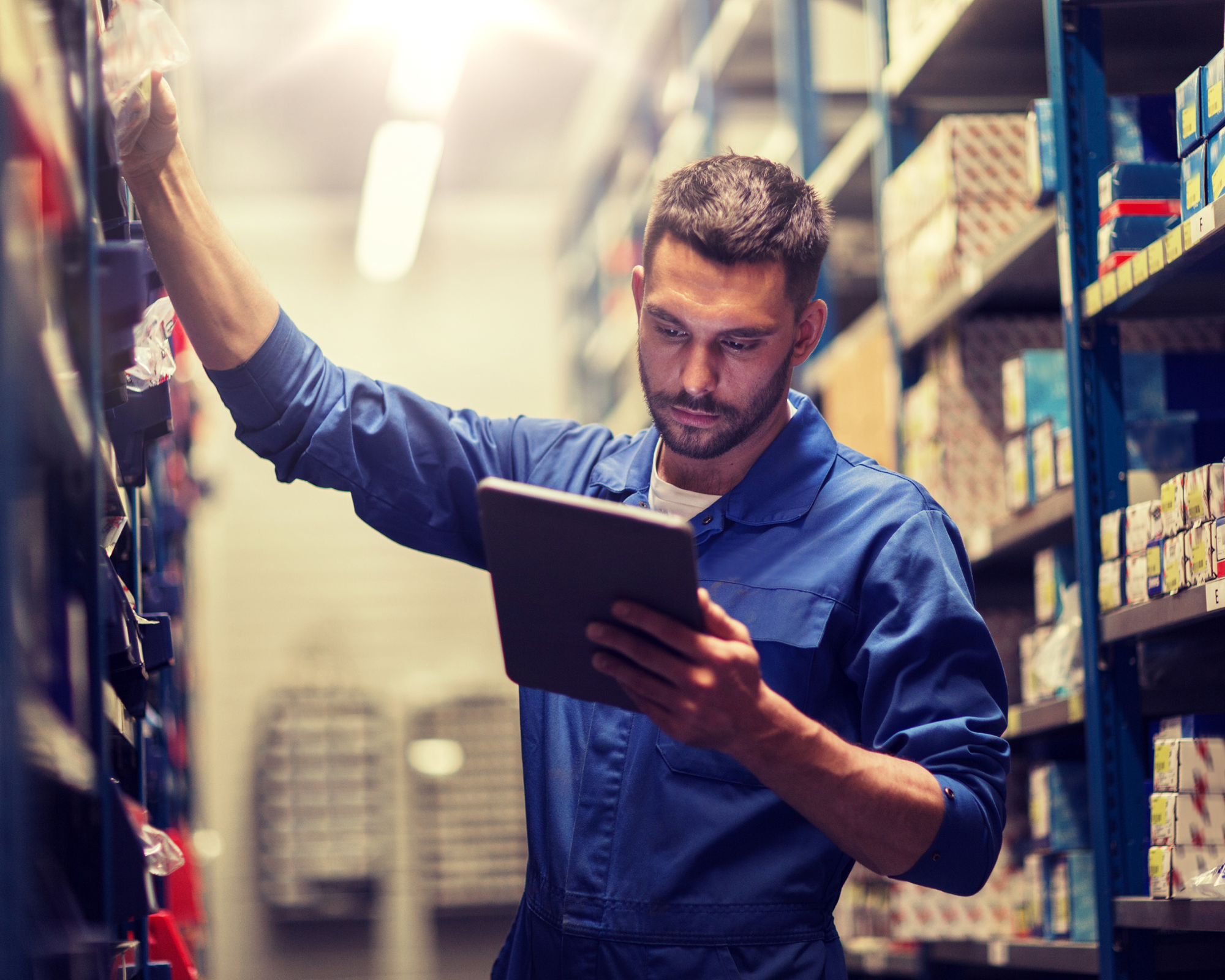 Warehouse worker using a tablet for inventory operations